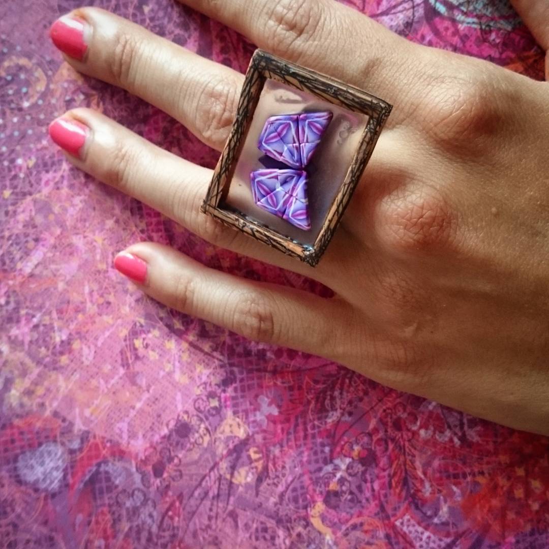 Hand of crazy woman with Moth ring